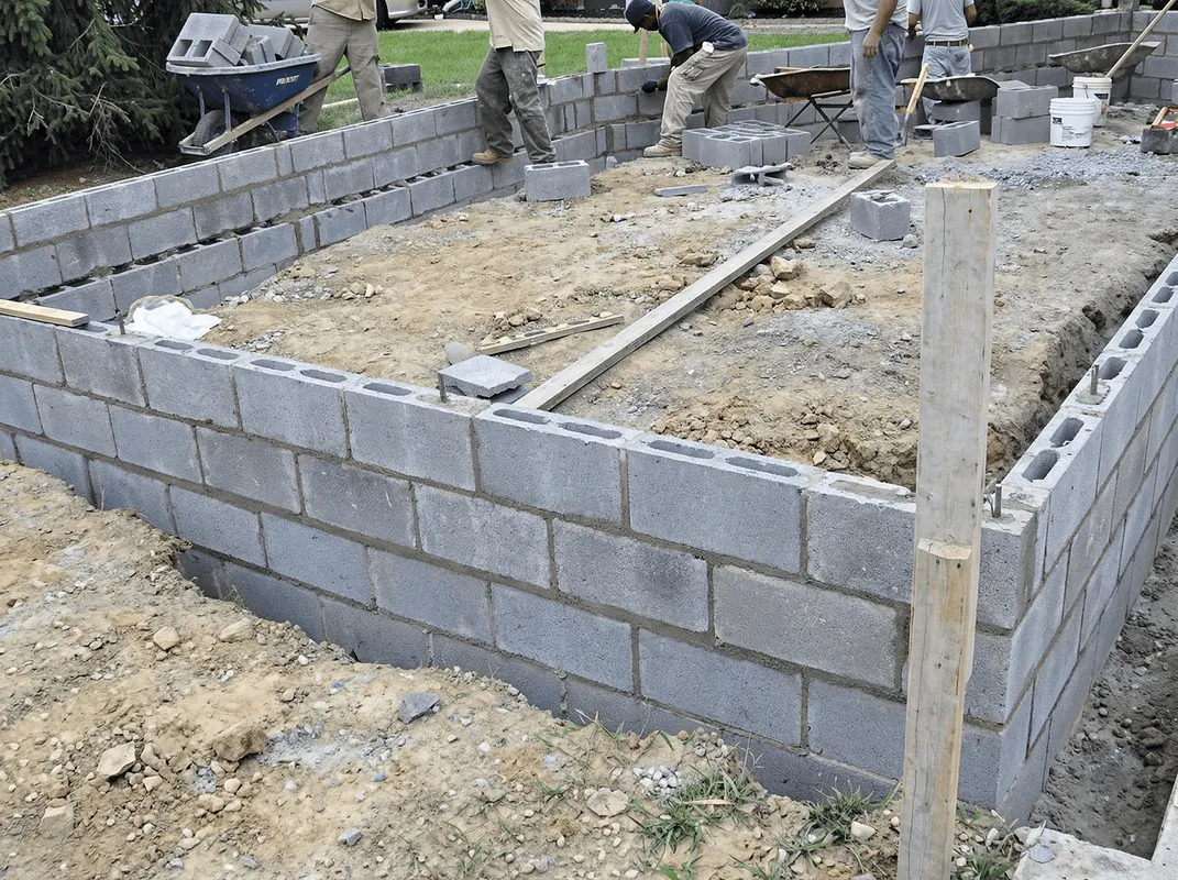 Professionals building a foundation with blocks in Scottsdale, AZ